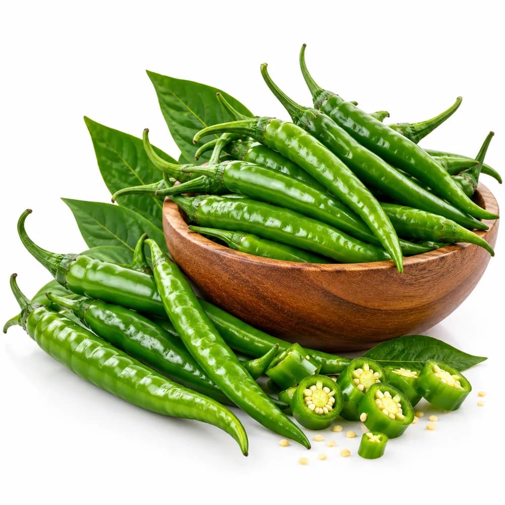 Fresh green chillies in a wooden bowl